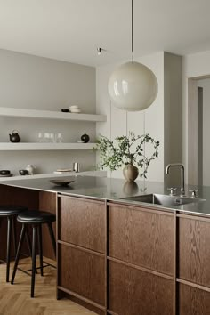 a modern kitchen with wooden cabinets and counter tops