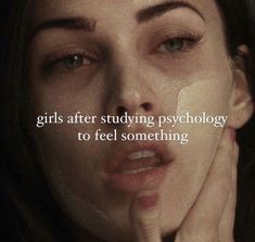 a woman holding her hand to her face with the words girls after studying psychology to feel something