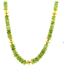 This pretty necklace features a beautiful collection of green tourmaline beads and is adjustable in length! The fine tourmaline beads have bright green color and graduate in size from 5.50 to 8.5mm in diameter. The tourmalines have been arranged with two types of lovely 18k yellow gold beads - a textured, round lentil-shaped bead and delicate 18k yellow gold faceted cubes. The rich yellow gold accents elevate this necklace to transition easily between casual and dressy occasions! A beautifully d Luxury Hand-strung Round Beaded Necklaces, Luxury Yellow Gold Rondelle Beaded Necklaces, Luxury Yellow Gold Round Beaded Necklace, Bright Green Color, Green Beaded Necklace, Pretty Necklace, Tourmaline Beads, Pretty Necklaces, Ring Pendant Necklace