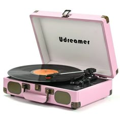 a pink suitcase with an old record player in it's lid and the word urbanet printed on the side