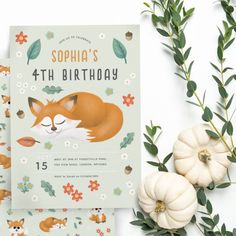 two birthday cards with an image of a sleeping fox and flowers on them, next to some pumpkins