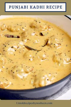 a close up of a bowl of food on a table with the words pujjabi kadh recipe