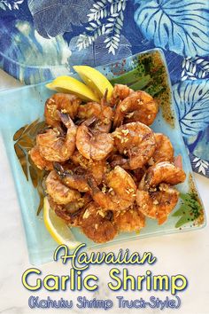 hawaiian garlic shrimp served on a blue plate