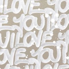 the words love you are written in white paint