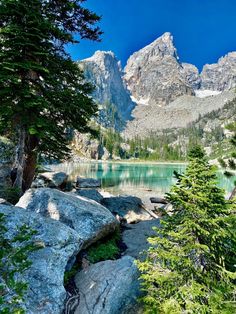 a mountain lake surrounded by trees and rocks