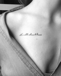 the back of a woman's shoulder with an inscription on it