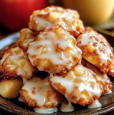 a plate topped with fried apples covered in icing