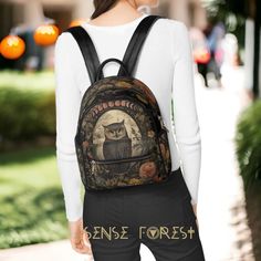 "Owl witchy mini black backpack, Retro cottagecore moon phase Women vegan leather Backpack, Kawaii whimsy goth back to school day pack * School backpack made of vegan leather with sublimation print * Size: H10.8\" x W10.2\" x D 5.1\"* 1 Main compartment for books, a small laptop and iPad,etc. * Metal zipper closure and 2 sides with zipper pockets * Adjustable slide shoulder straps buckles with inner pocket ❣️PRODUCTION and DELIVERY TERMS: All items are shipped out from our China print provider a Cute Halloween Backpack For Everyday Use, Cute Halloween Travel Backpack, Mini Black Backpack, Cottagecore Bag, Backpack Kawaii, Retro Cottagecore, Goth Kawaii, Leather Cosmetic Bag, Vegan Leather Backpack