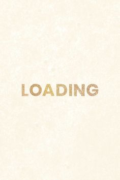 the word loading is written in gold foil on a white paper with a black border