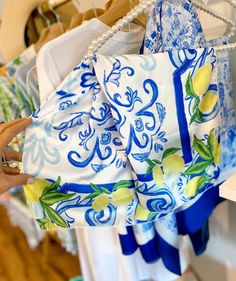 Aperitivo hour, spritz in hand, scarf wrapped - can you almost feel the breeze? Whether you're dining alfresco in Capri or at your local brunch hot spot, this scarf adds effortless style. *Limited Edition Lemons on a Mediterranean inspired blue and white pattern, fabric is satin charmeuse Please allow 2-3 weeks for our scarves Chic Scarves For Beach In Spring, Blue Summer Scarves For Vacation, Chic Scarves For Spring Beach, Chic Scarves For Spring Vacation, Chic Spring Vacation Scarves, Chic Silk Scarf For Beach In Spring, Summer Vacation Scarves One Size, Chic Silk Scarf For Summer, Silk Scarf For Beach In Spring