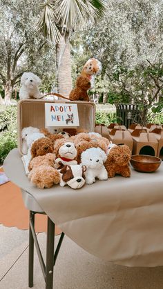 several stuffed animals are sitting on a table