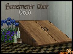 the basement door is open and there are blue flowers in vases on the floor