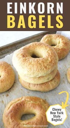 four bagels sitting on top of a baking sheet