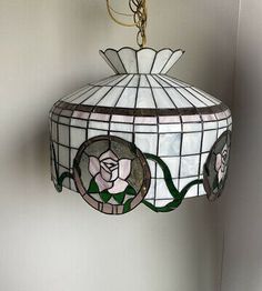 a stained glass lamp hanging from the ceiling