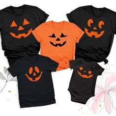 Pumpkin Face Halloween Shirt, Family Matching Halloween Tshirt, Halloween Party Group Shirts, Spooky Pumpkin Outfits, Family Pumpkin Tees The Pumpkin Face Halloween Shirt is the perfect way to bring spooky fun to your Halloween celebrations! Our Family Matching Halloween Tshirt is ideal for creating memorable moments with loved ones. Whether you're attending a Halloween party or just want to get into the festive spirit, our Halloween Party Group Shirts ensure everyone looks coordinated and styli Family Matching Black Tops For Halloween, Family Matching Black Tops With Character Print, Black Family Matching Tops With Character Print, Funny Halloween Tops With Character Print, Family Matching Halloween Tops Short Sleeve, Funny Character Print Tops For Halloween, Spooky Character Print Tops For Costume Party, Orange Halloween Tops With Character Print, Family Matching Black Tops For Fall