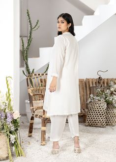 White pure cotton lawn medium length kurta all handworked with white resham. Details on the neckline and sleeves and Booti chan all over. Fully lined with white lawn. (Includes shirt only) White Naqshi Kurta For Spring, Cotton Sets With Chikankari Embroidery Tunic, White Cambric Salwar Kameez With Long Sleeves, White Cotton Long Sleeve Kurta, White Lawn Suit With Dabka Work Straight Kurta, Eid Cotton Kurta With Naqshi Embroidery, White Long Sleeve Cambric Salwar Kameez, White Linen Straight Kurta Set, White Mulmul Lawn Suit With Straight Kurta