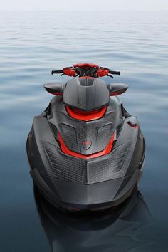 a gray and red jet ski is in the middle of the water with no people around it