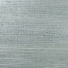 a close up view of the textured surface of an old wallpapered fabric