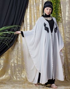 Women exclusive butterfly style abaya Right one for exclusive look and left is normal bell Loose and elegant trendy fit to all Premium Shine Nida Fabric with rich look Flared party abaya Hijab and band shown in the image can be bought separately Fabric: Upper 100% Polyester Georgette, Inner 100% Polyester Crepe ( Matt Nida)Care: Mild machine wash/ hand Cold Wash/ Dry cleanWe request customers to carefully choose the correct size and dress length referring to our size chart Party Abaya, Embroidered Abaya, Abaya Hijab, Butterfly Style, Trendy Fits, Modest Wear, Pink Fabric, Festival Wear, Full Sleeve