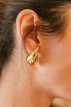 Add some glam to your earring collection with our Gold Drop Earrings! Lightweight on the ear and a fun twist on the classic gold hoop, a perfect statement piece. They are great for everyday wear, wedding, festival, or enjoying a GNO! Non-tarnish, water resistant. Made in Italy. Lightweight 1/2" wide x 1" long Elegant Gold Huggie Earrings For Party, Elegant Yellow Gold Wrap Earrings For Party, Tarnish Resistant Small Hoop Earrings For Party, Gold Huggie Earrings For Party, Gold Huggie Jewelry For Parties, Yellow Gold Tarnish-resistant Hoop Earrings For Party, Party Yellow Gold Hoop Earrings Tarnish Resistant, Yellow Gold Tarnish Resistant Hoop Earrings For Party, Party Yellow Gold Tarnish-resistant Hoop Earrings