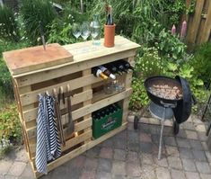 an outdoor bbq grill made out of pallet wood