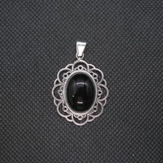 Brand new sterling silver pendant with 18x13mm black onyx - PE001454. Stamped 925. Approximate weight 7.0 grams. Dimensions 29x25mm (1.16x1.00 inches). All our jewels are made from solid sterling silver 925/1000 and are carefully crafted by hand in our family workshop. We dispatch your orders in 5 working days, worldwide and the postage is $5. We ship registered priority mail. Please allow 5-7 working days for delivery in Europe and 10-15 working days outside Europe. For any questions - please d Black 925 Stamped Pendant Jewelry, Black Hallmarked Round Pendant Jewelry, Classic Black Oval Pendant Jewelry, Black Engraved Oval Pendant Jewelry, Black Oval Engraved Jewelry, Oval Black Engraved Jewelry, Black Sterling Silver Jewelry With Oval Cabochon, Black Oval Cabochon Sterling Silver Jewelry, Black Round Pendant Jewelry With Cabochon