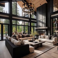 a living room filled with lots of furniture next to large windows and a fire place