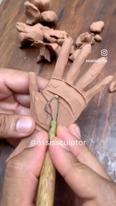 someone is making something out of clay