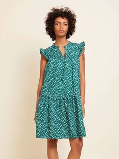 The packable vacation mini everyone needs. Featuring a mandarin collar, an A-line, single tiered skirt, and a little vintage flair via ruffled shoulders and bib pintucks. (This one comes in Emerald Floral.) | Jasmine Dress in Emerald Floral | Ethical Essentials Transitional Dressing, Ruffled Mini Dress, Jasmine Dress, Nation Ltd, Breezy Dress, Ruffle Mini Dress, Satin Top, Tier Skirt, Tiered Skirt