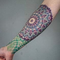 a person with a colorful tattoo on their arm