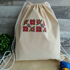 Introducing our exquisite handmade Backpack adorned with intricate Bulgarian tradition embroidery, creating a vintage rucksack that seamlessly combines style and tradition. Handcrafted with love and care, this unique piece is sure to make a statement wherever you go. - Backpack embroidery Bulgarian tradition embroidery vintage rucksack - Size: 37/34cm - Cotton fabric Add a touch of Bulgarian culture to your wardrobe with this stunning embroidered rucksack. Embrace tradition with every step you take and let your style speak for itself. Purchase your very own Backpack embroidery Bulgarian tradition embroidery vintage rucksack today and make a bold fashion statement! Material: cotton fabric Embroidered Rectangular Backpack For Daily Use, Embroidered Rectangular Backpack, Daily Use Embroidered Rectangular Backpack, Traditional Travel Backpack, Traditional Beige Bags With Floral Embroidery, Traditional Handmade Rectangular Backpack, Traditional Handmade Backpack, Backpack Embroidery, Bulgarian Culture