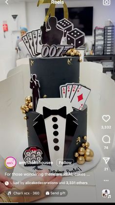 a cake that is decorated with cards and casino symbols on it's top tier