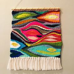 a colorful tapestry hanging on the wall