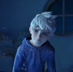 a young boy with white hair wearing a blue hoodie and looking at the camera