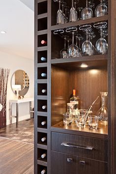 a wooden cabinet with wine glasses on it