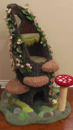 the mushroom house is made out of fake grass and flowers on it's roof