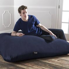 a man sitting on an inflatable bean bag chair