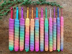 there are many different colored toothbrushes lined up on the table next to each other