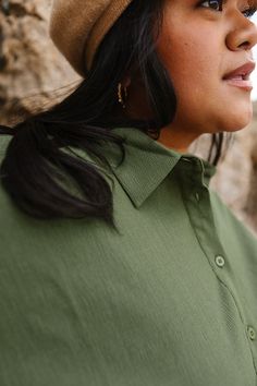 Fall in love with the Newport Blouse in Olive, where autumn hues meet effortless style. The V-neckline with collar and half-length fitted sleeves create a chic silhouette, while the functional buttons add a touch of charm. Perfect for cozy gatherings and nursing-friendly, this blouse is your go-to for fall fashion! Fall V-neck Blouse With Placket, Fall V-neck Everyday Blouse, Everyday Fall V-neck Blouse, V-neck Blouse For Everyday Fall Wear, Fall Short Sleeve Blouse With Button Cuffs, Chic Everyday Blouse With Collared Neckline, Fall Blouse With 3/4 Sleeves And Button Closure, Fall Daywear Blouse With Rolled Sleeves, Fall Blouse With Collared Neckline And Relaxed Fit