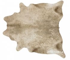 a cowhide rug is shown on a white background