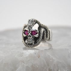 Snake Silver Ring, Skull Design, 925 Sterling Silver, Garnet Gemstone Ring,Special Design Biker Ring,Unisex Vintage Silver,Biker Style Ring  ✦ Details ✦ * Material: 925 Sterling Silver * Gemstone: Garnet * Weight: 14,50 grams * Sides oxidized * Stamp: 925 * Available sizes; 5 US to 16 US. Contact me if you need any other size! ✦ Shipping ✦ * Processing time: 1-3 business days. * This item ships from my Turkish workshop in Istanbul. * Add your phone number in address box for a smoother delivery. Silver Skull Ring With Gemstone, Sterling Silver Skull Ring With Gemstone, Biker Rings, Luxury Gift Box, Skull Design, Biker Style, Garnet Gemstone, Special Design, Gemstone Ring