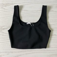 New Without Tags Women’s Size Small Black Stretchy Material 100% Polyester Approx Measurements Laying Flat Pit To Pit 14" Waist 11" Trendy Black Crop Top With Scoop Neck, Trendy Black Scoop Neck Crop Top, Basic Black Crop Top With Scoop Neck, Chic Black Elastane Crop Top, Chic Black Scoop Neck Crop Top, Casual Black Crop Top With Scoop Neck, Black Elastane Crop Top For Spring, Trendy Black Crop Top, Casual Black Scoop Neck Crop Top