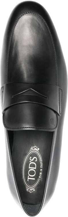 Elevate your look with these classic black leather slip-on loafers from Tod's. Whether you're heading to a meeting or meeting up with friends, this effortlessly sophisticated pair will keep you stylish and comfortable all day long. High-shine finish on black calfskin upper Branded leather insole for extra luxury Ultimate comfort with low heel silhouette Versace Bags, Prada Designer, Balenciaga Designer, Shoes Uk, Elevate Your Look, Black Slip Ons, Lv Bag, Fendi Bags, Leather Slip Ons