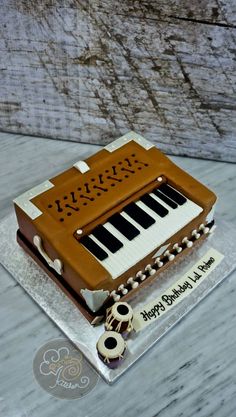 a cake made to look like an old fashioned musical instrument on top of a table