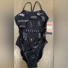 Brand New With Tags, Never Used. Size 28/ Us 2 Spring Sports Black Bodysuit, Black Sports Bodysuit For Spring, Black Spring Sports Bodysuit, Black Bodysuit For Sports In Spring, Nike Summer Pool Bodysuit, Nike Spring Swimwear For Swimming, Nike Swimwear For Spring Swimming, Nike Black Sleeveless Swimwear, Spring Nike Swimwear For Swimming