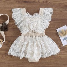 Get your little one ready to steal the show with our EDEN Lace Romper! This adorable baby girl dress features a delicate lace tulle skirt, making her the center of attention. Perfect for special occasions and guaranteed to make a lasting impression. (Seriously, prepare for compliments!) Summer Lace Dress With Lace Bodice For Dress-up, Cute Fitted Lace Baptism Dress, Summer Lace Tutu Dress For Dress-up, Fitted Lace Bodice Tutu Dress, Spring Baptism Dress With Lace Patchwork, Sleeveless Lace Bodice Tutu Dress, Scalloped Lace Dress For Dress-up Events, Elegant First Birthday Summer Tutu Dress, Spring Tutu Dress With Lace Bodice For Dress-up