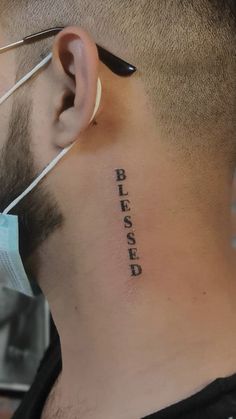 a man with a tattoo on his neck that says please closed behind him is a stethoscope