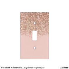 a light switch cover with pink and gold glitter