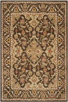 a brown and beige rug with an ornate design