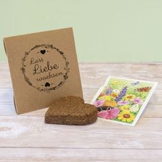 a heart shaped cookie next to a greeting card